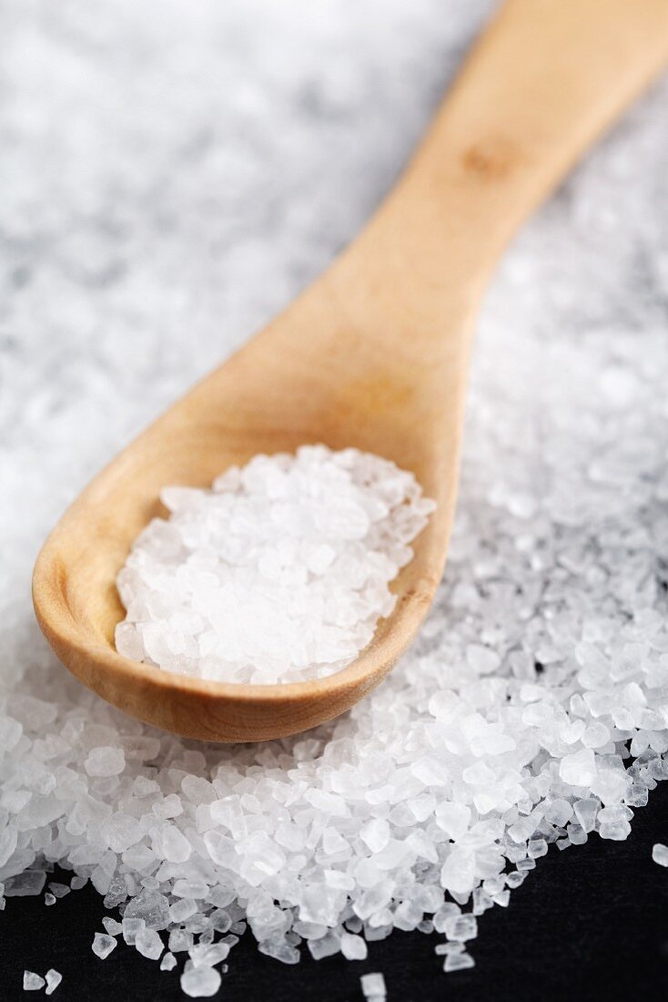 Coarse salt with a wooden spoon