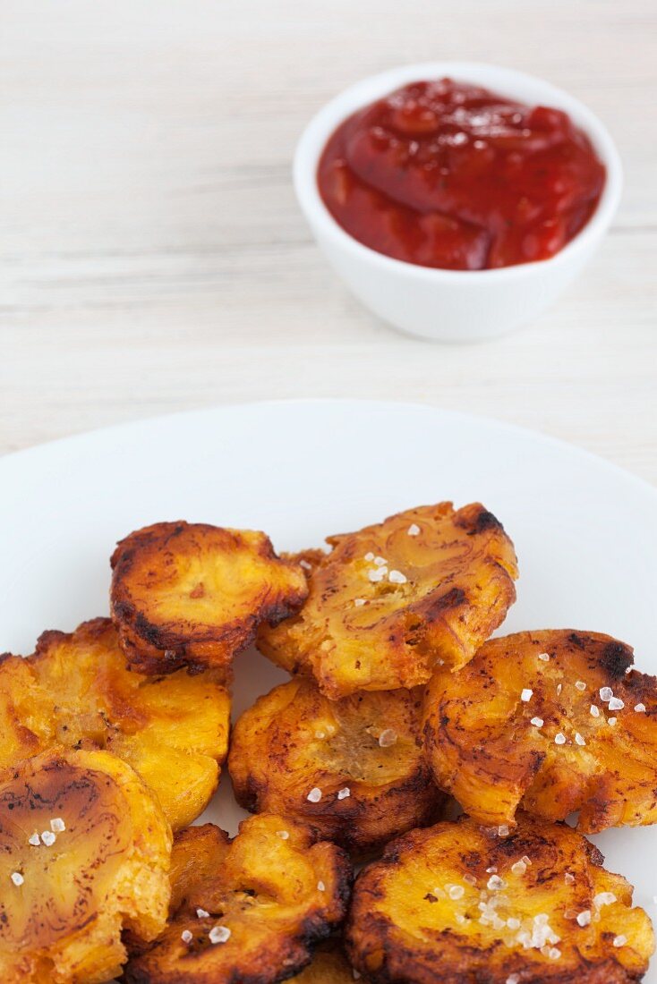 Fried plantains with salt and chilli sauce