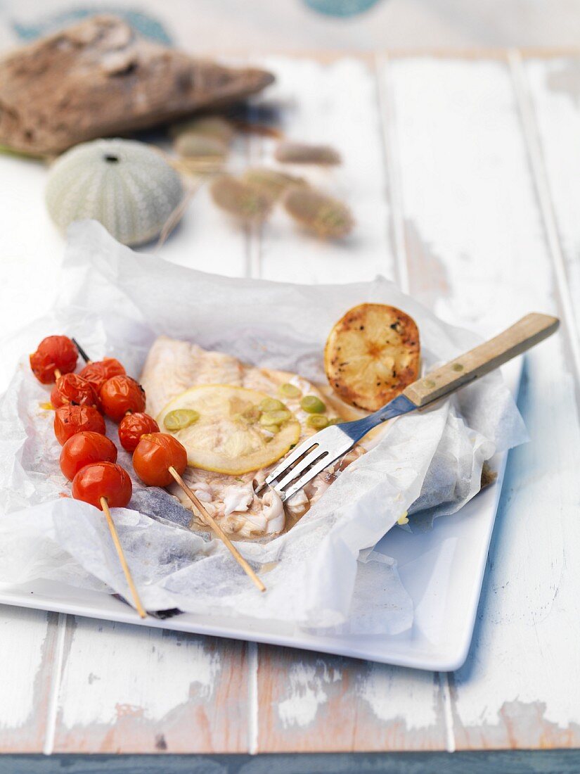 Grilled fish with tomato kebabs