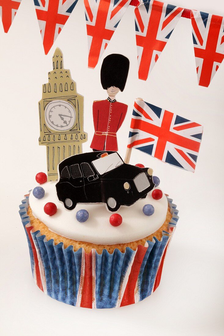 A cupcake decorated with London icons
