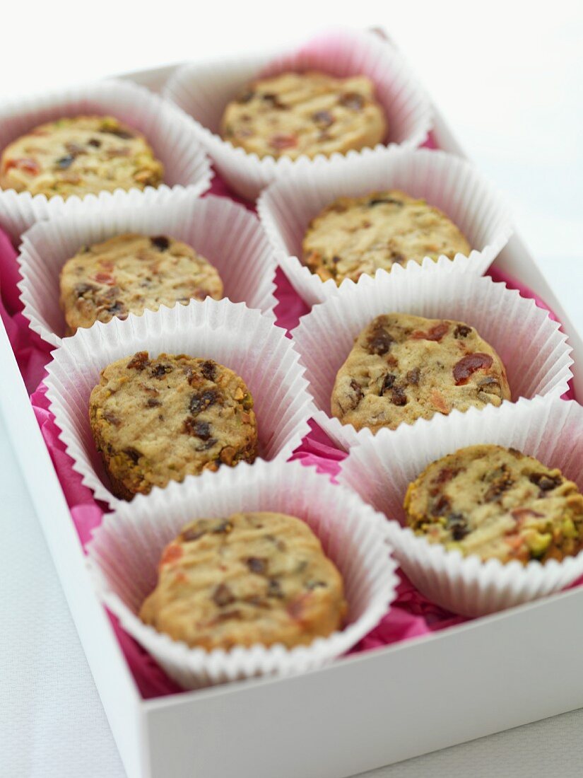 Biscuits with dried fruit in paper cases in a box