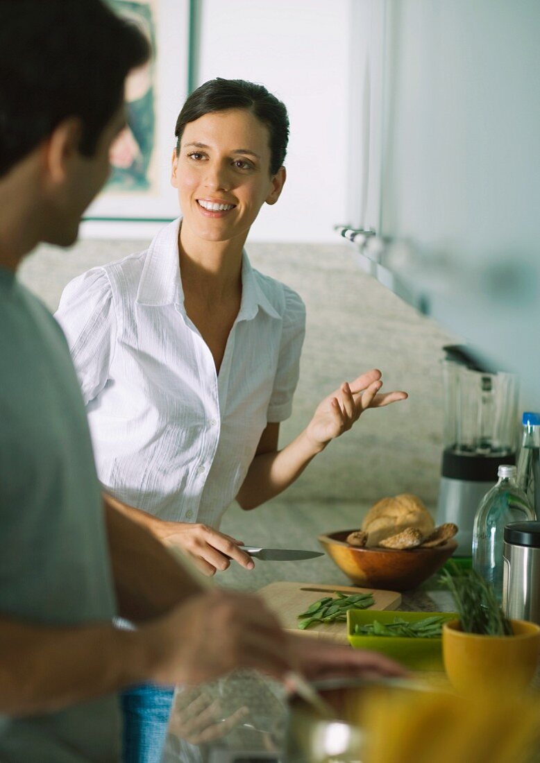 Couple cooking in kitchen together