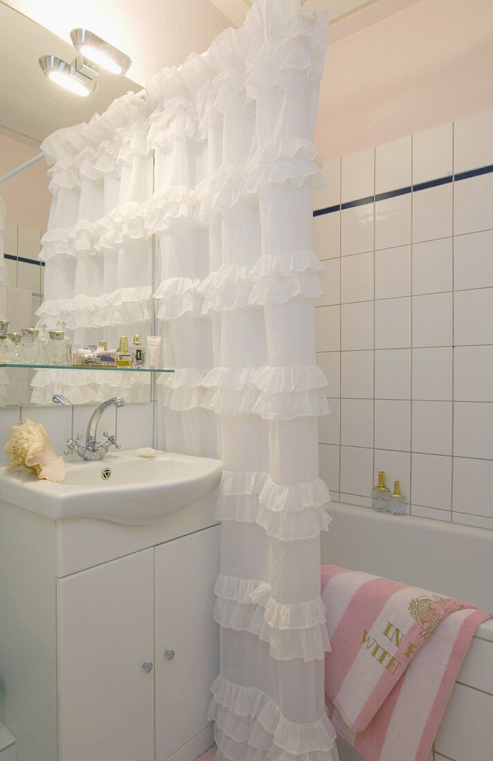 Bathroom with shower curtain at bathtub