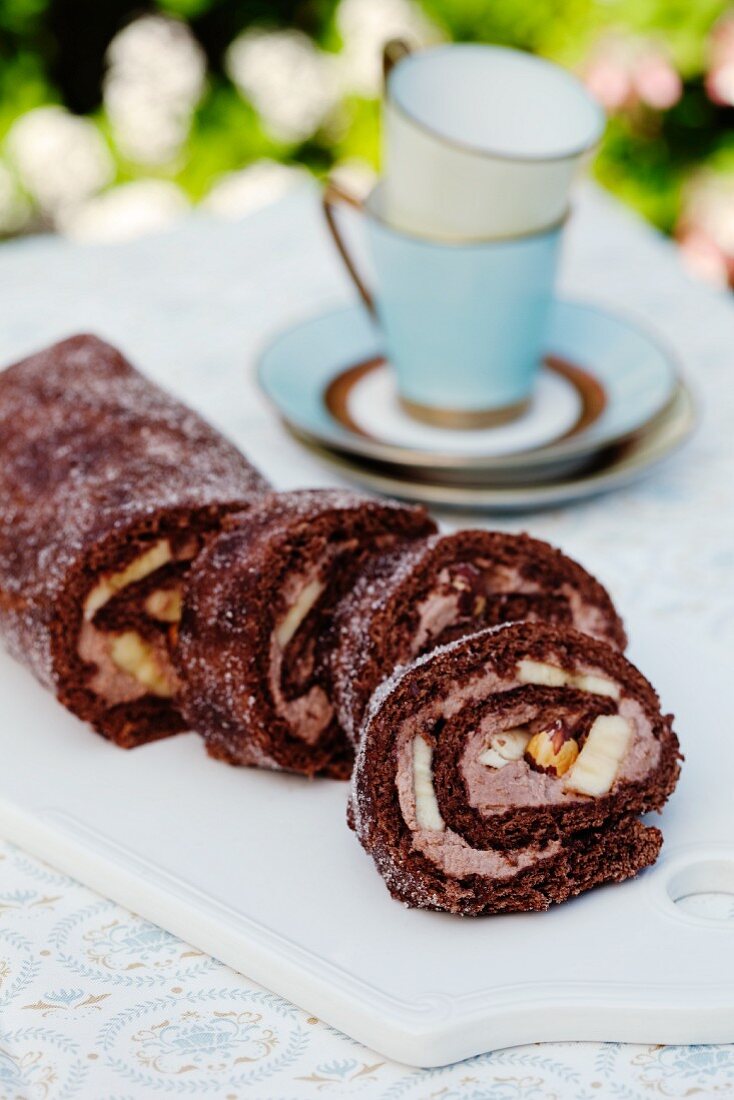Chocolate Swiss roll with bananas and hazelnuts