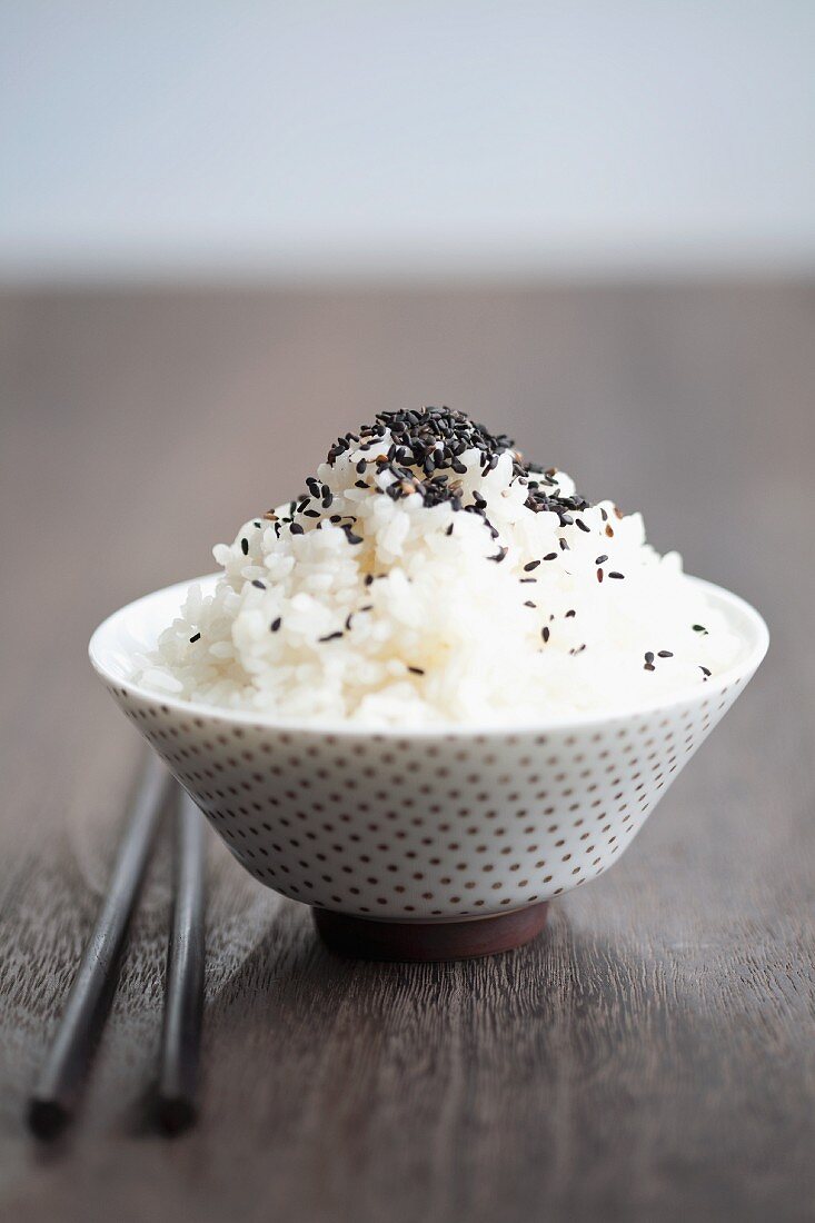 A bowl of rice with black sesame seeds