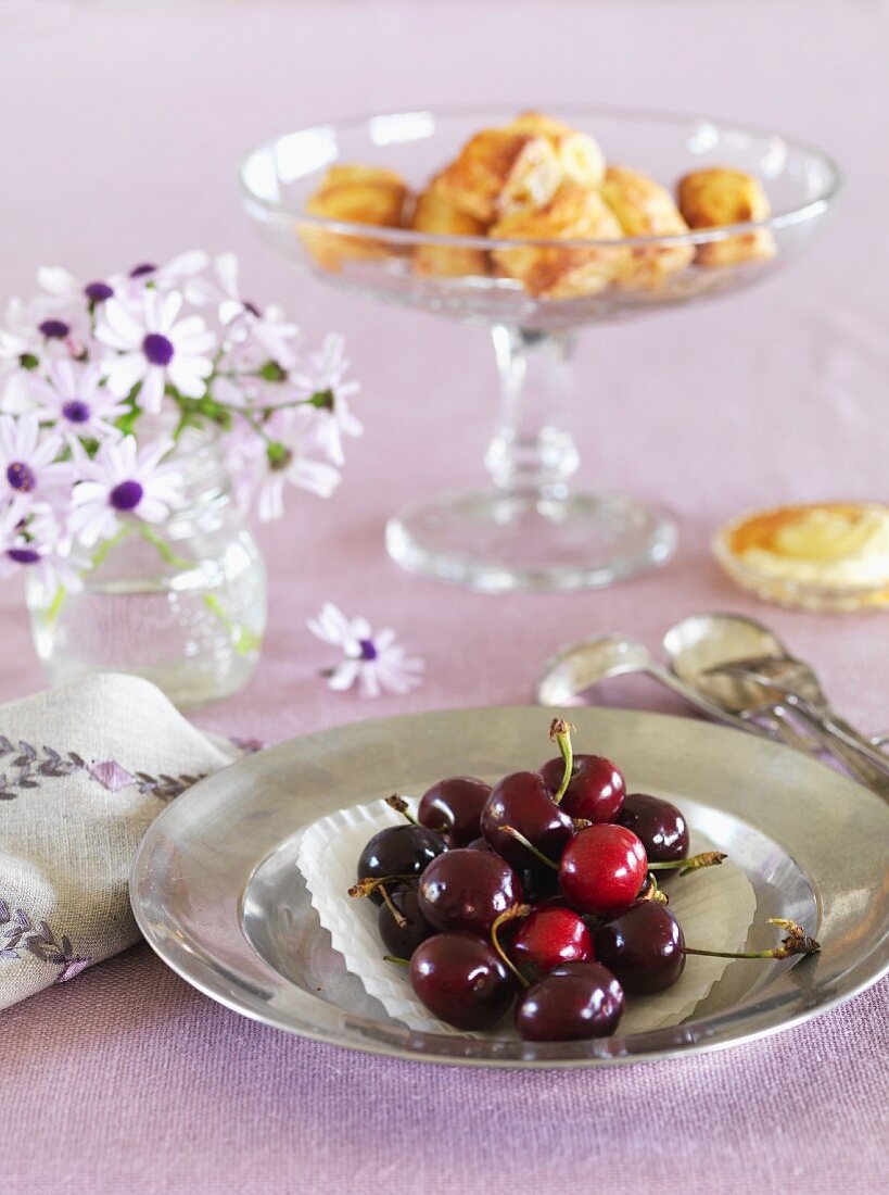 Fresh cherries on a silver plate