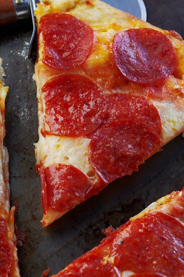 Salami pizza, sliced