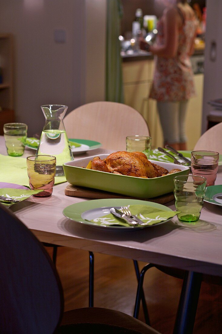 Roast chicken on a laid table