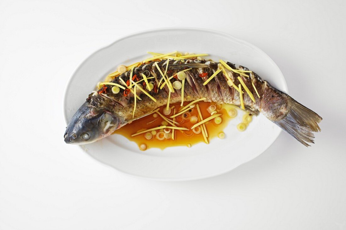 Steamed grass carp with Oriental spices