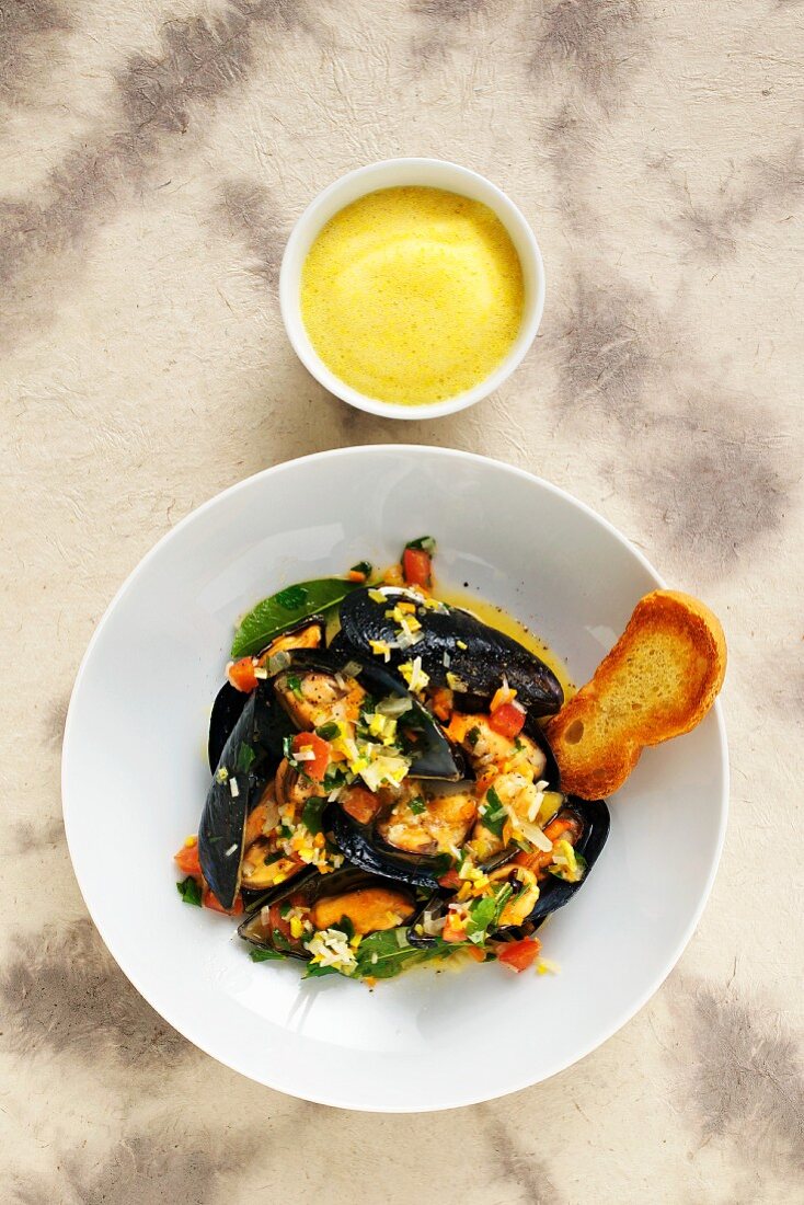 Mussels in a white wine broth with bread and aioli