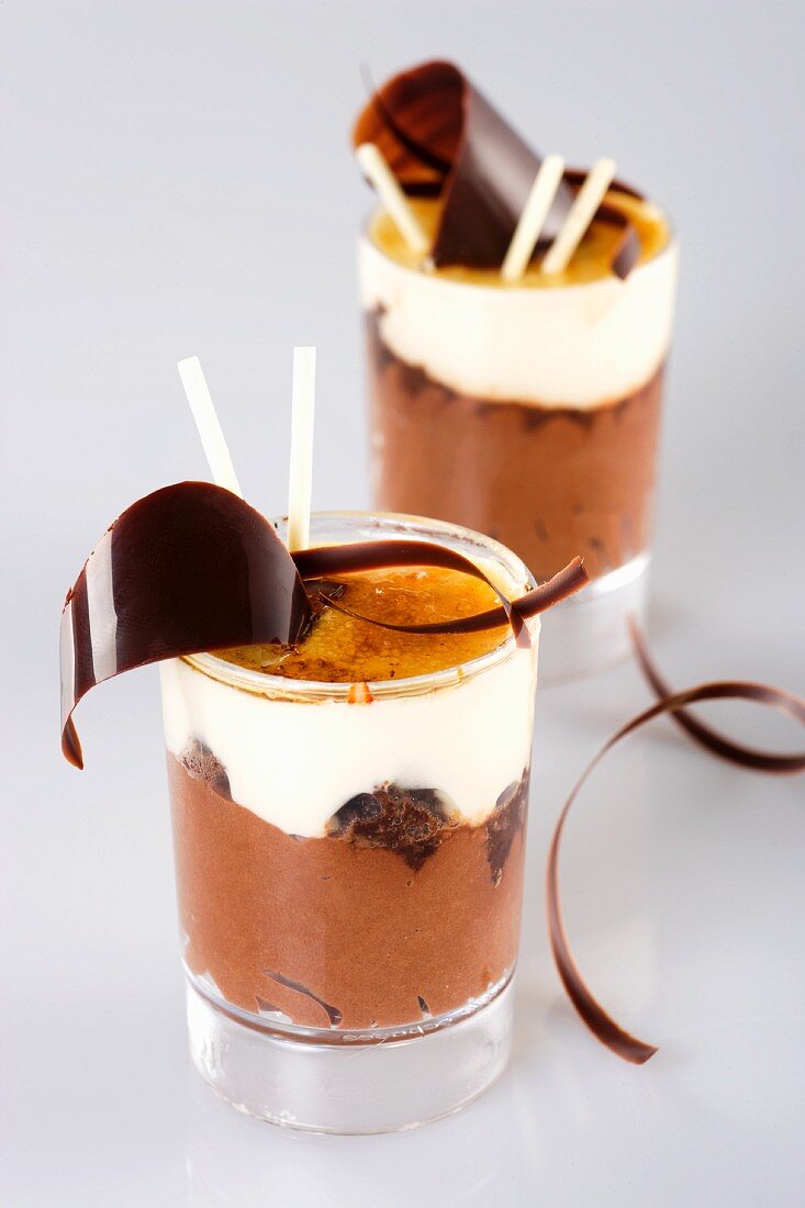 A layered desert with dark and white chocolate, biscuits and caramel