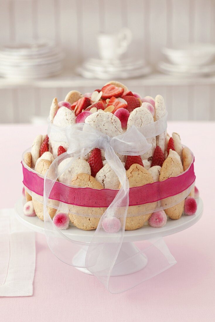 A celebratory almond meringue tart with strawberries and cream