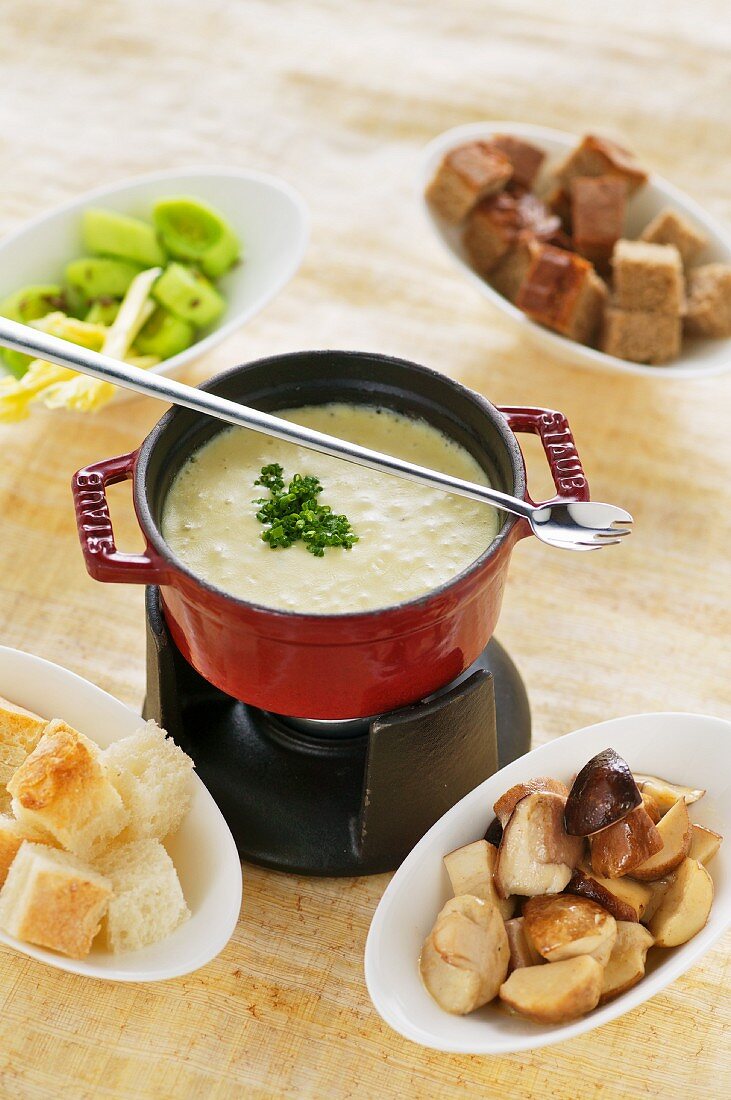 Cheese fondue with porcini mushrooms, breed and leek