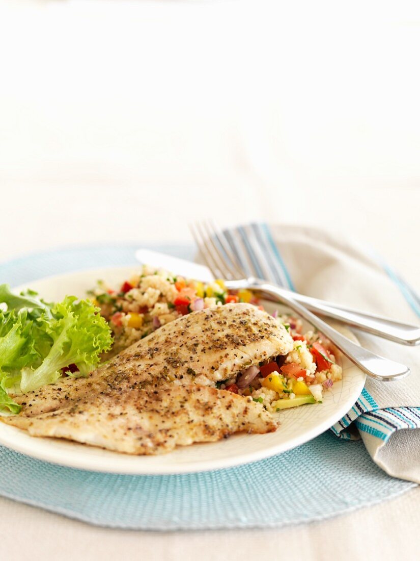 Fish fillet with lemons, pepper and couscous