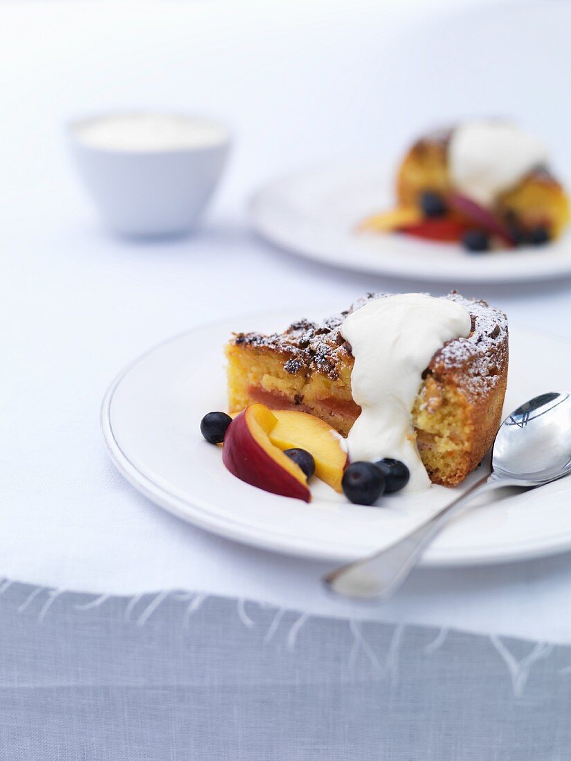 Nectarine cake with blueberries and cream