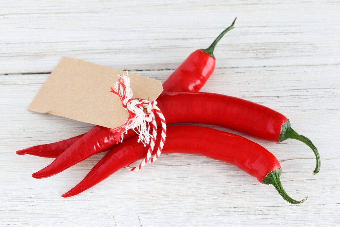 A bunch of red chilli peppers with a label