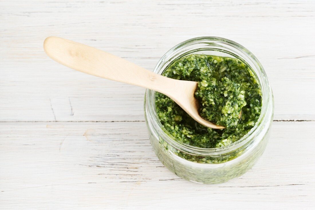 Rocket pesto in a glass with a spoon