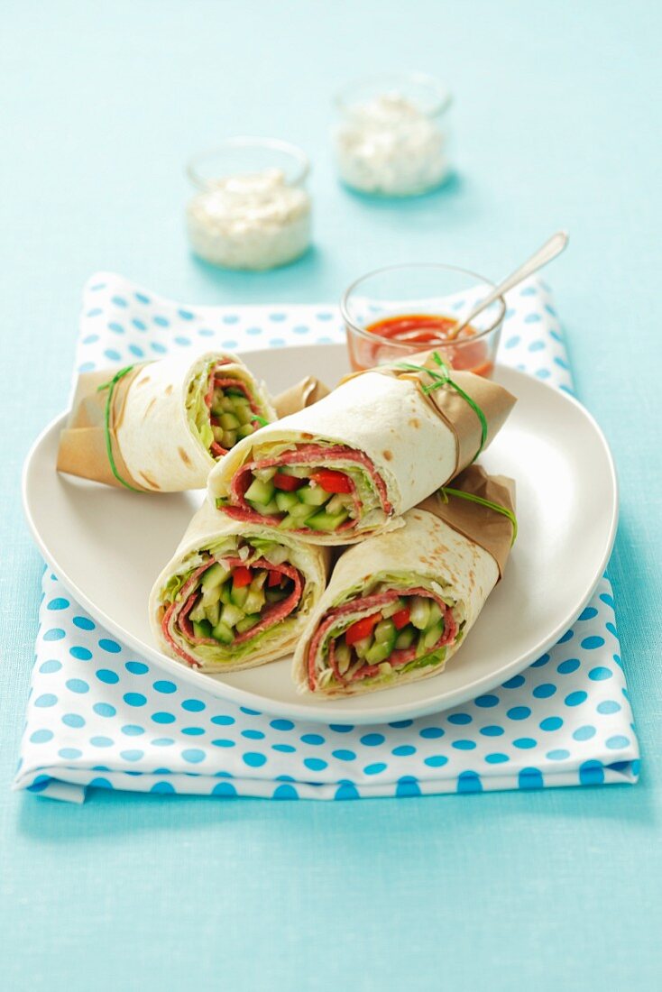 Wraps and salami and vegetables