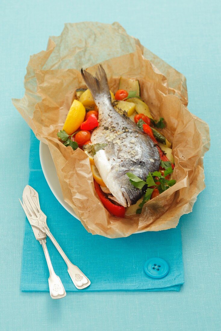 Trout with vegetables in parchment paper