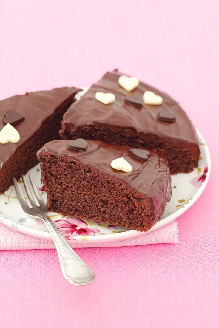 Chocolate cake with glaze and chocolate hearts