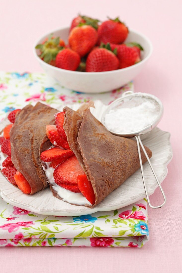 Chocolate pancakes with vanilla quark and strawberries
