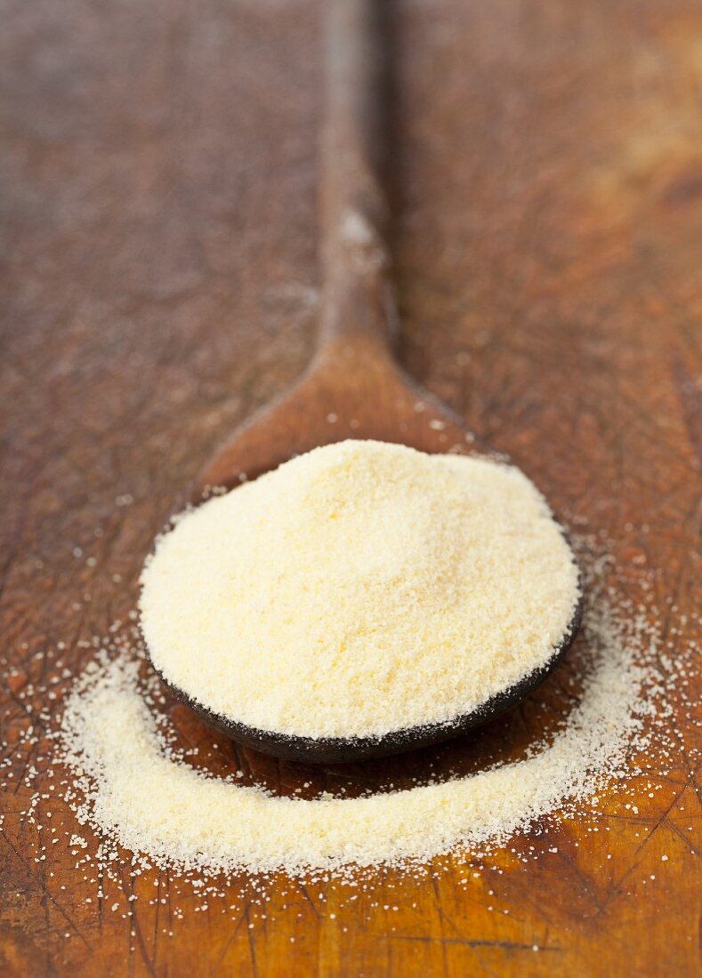 Durum wheat semolina on a wooden spoon