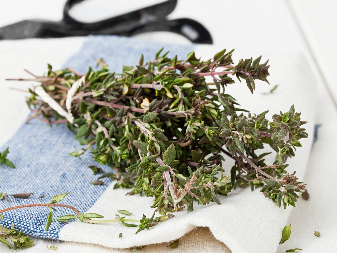 Fresh thyme on a kitchen towel