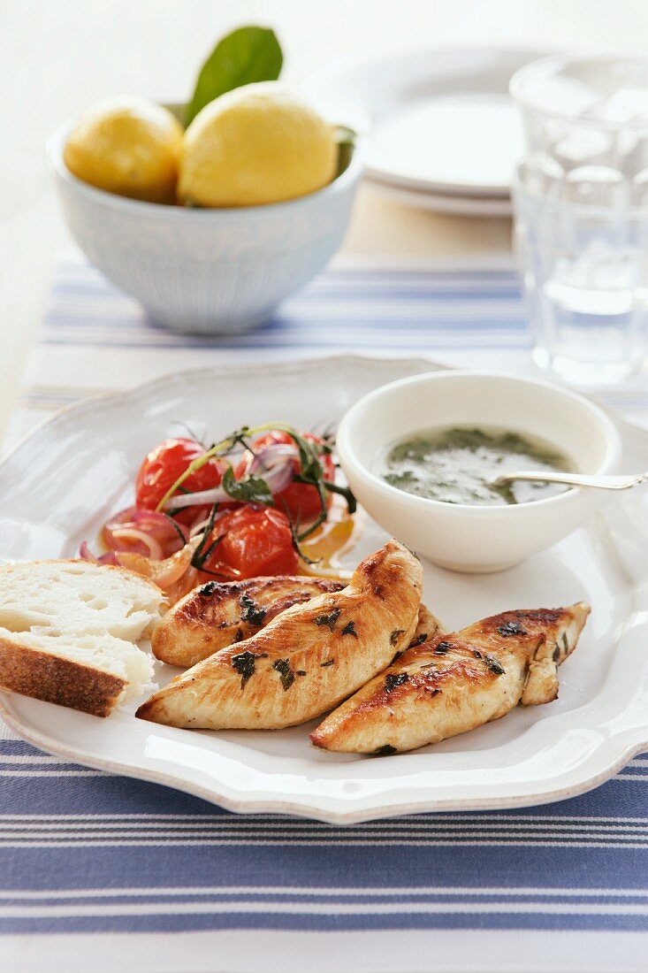 Grilled chicken breast with a herb sauce