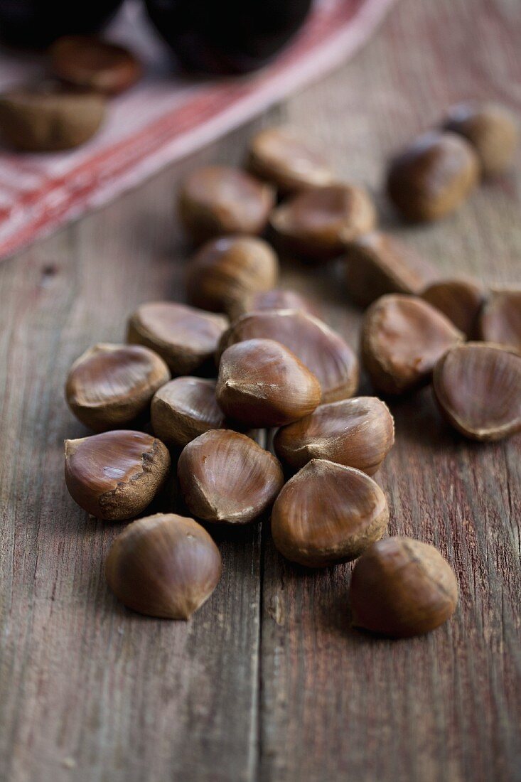 Chestnuts on a wooden surface