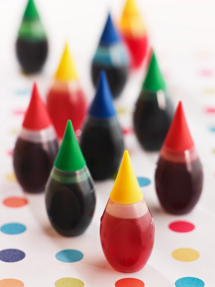 Food Coloring Bottles on Polk-a-Dot Surface