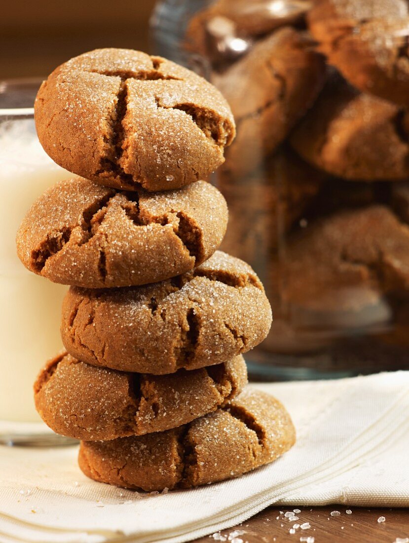 Stack of Molasses Cookies with a Glass of Milk; Jar of Cookies