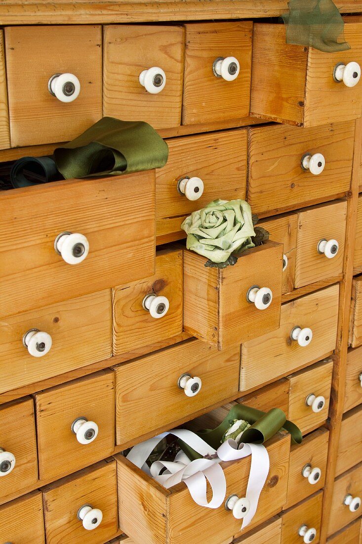 Wooden chest of drawers with some drawers open