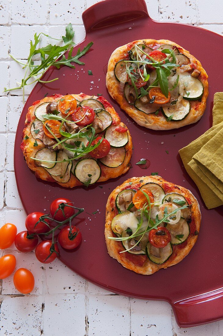 Mini pizzas topped with grilled vegetables