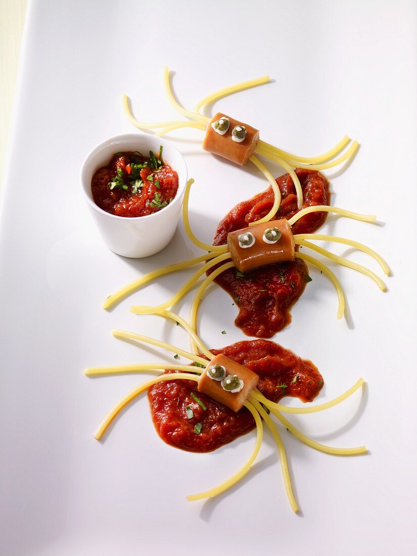 Spaghetti spiders on tomato sauce
