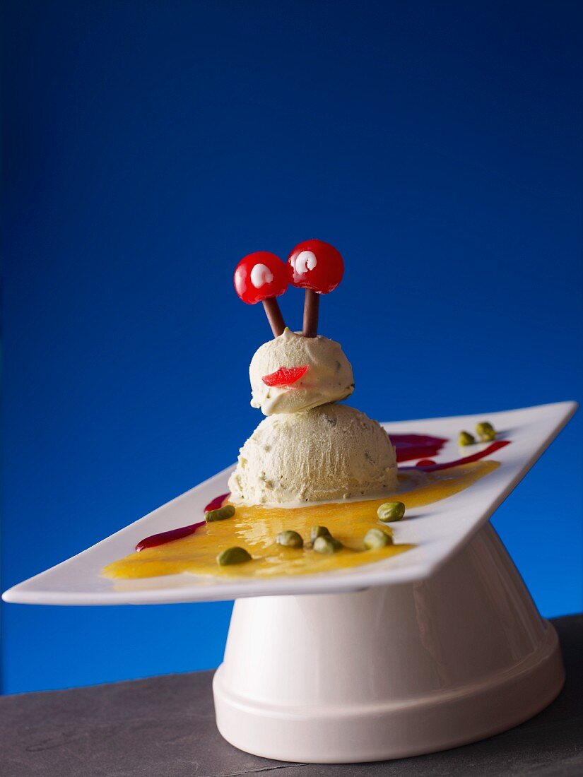 An alien made of pistachio ice cream and cocktail cherries