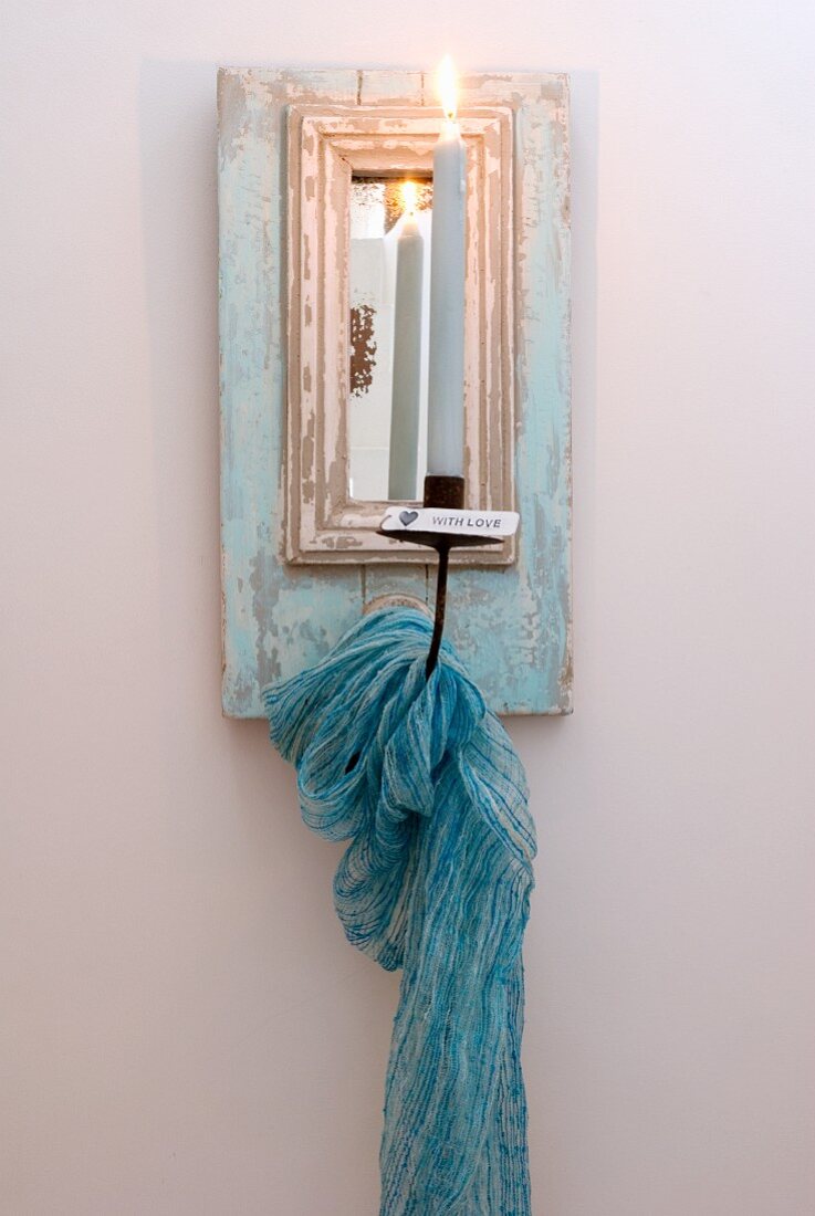 Candle sconce with mirror and draped scarf