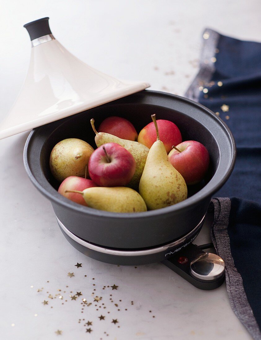 A tagine filled with apples and pears