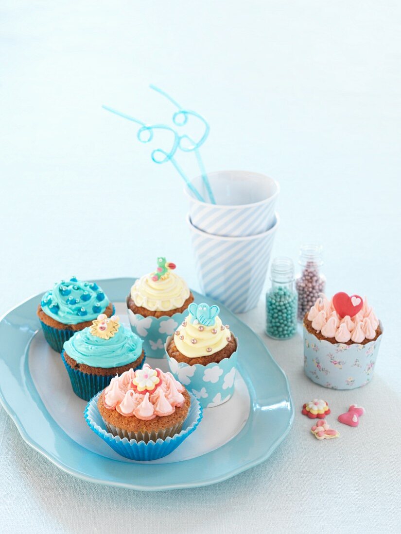 Various cupcakes with colourful decorations