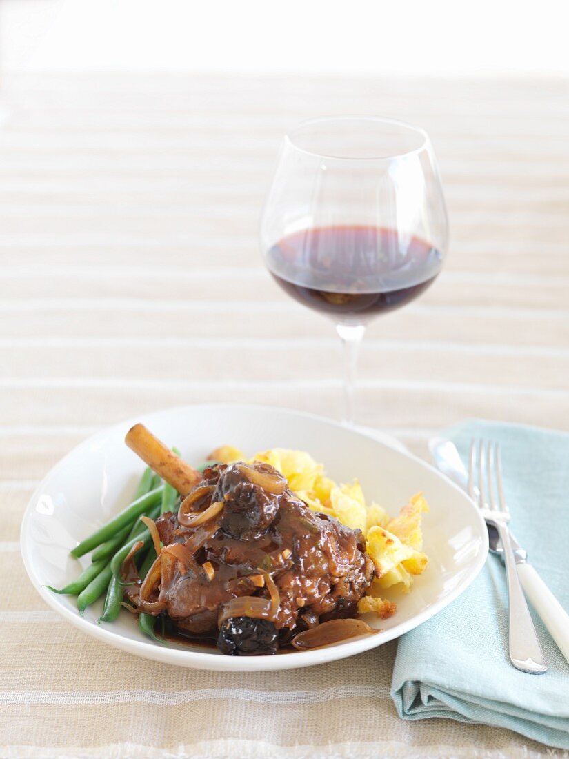 Braised knuckle of lamb and a glass of red wine