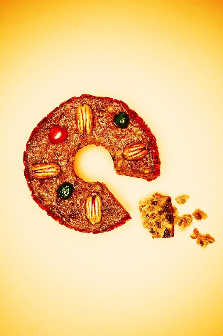Round Fruit Cake with Slice Taken Out; Crumbs; From Above