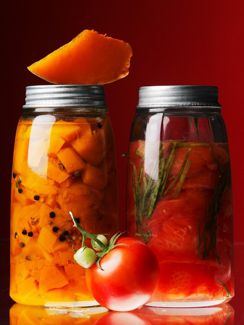 Jars of preserved pumpkin and tomatoes