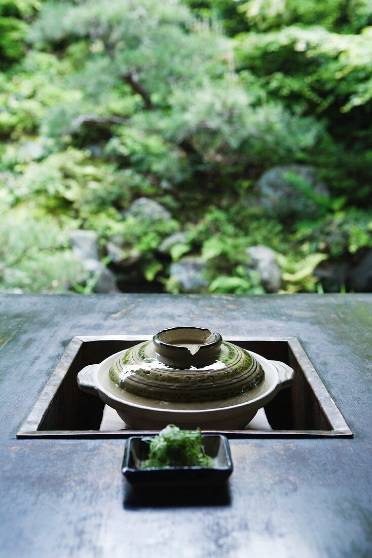 Japanese brazier, with dish of green soy noodles