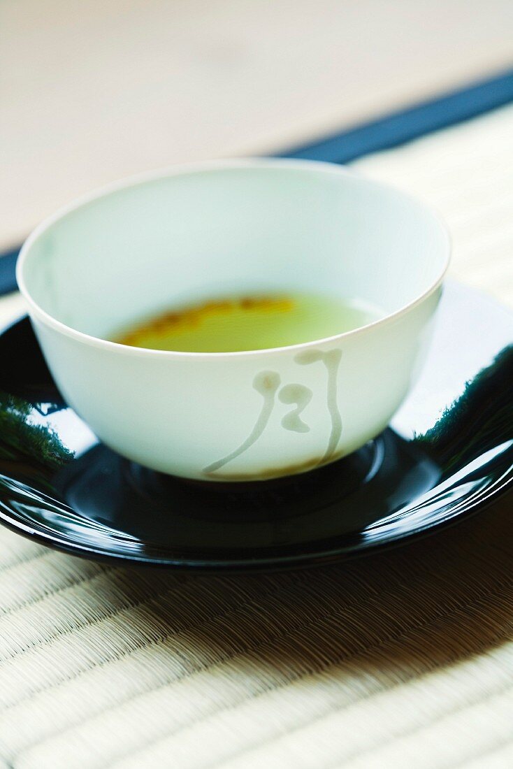 Cup of green tea, close-up