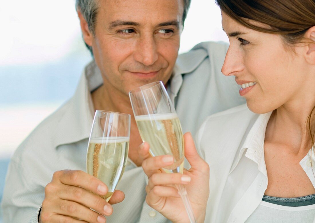 Couple clinking glasses of sparkling wine