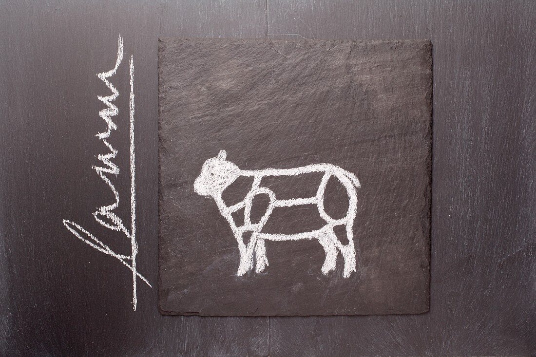 A sketch of a lamb on a chalkboard