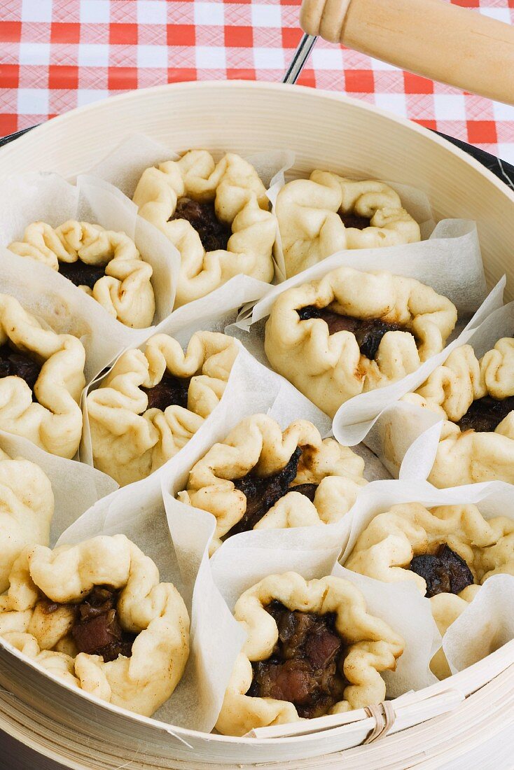 Baozi (steamed dough parcels, China) filled with pork