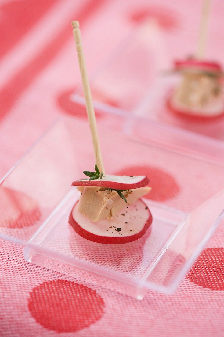 Radish and goose liver on a stick