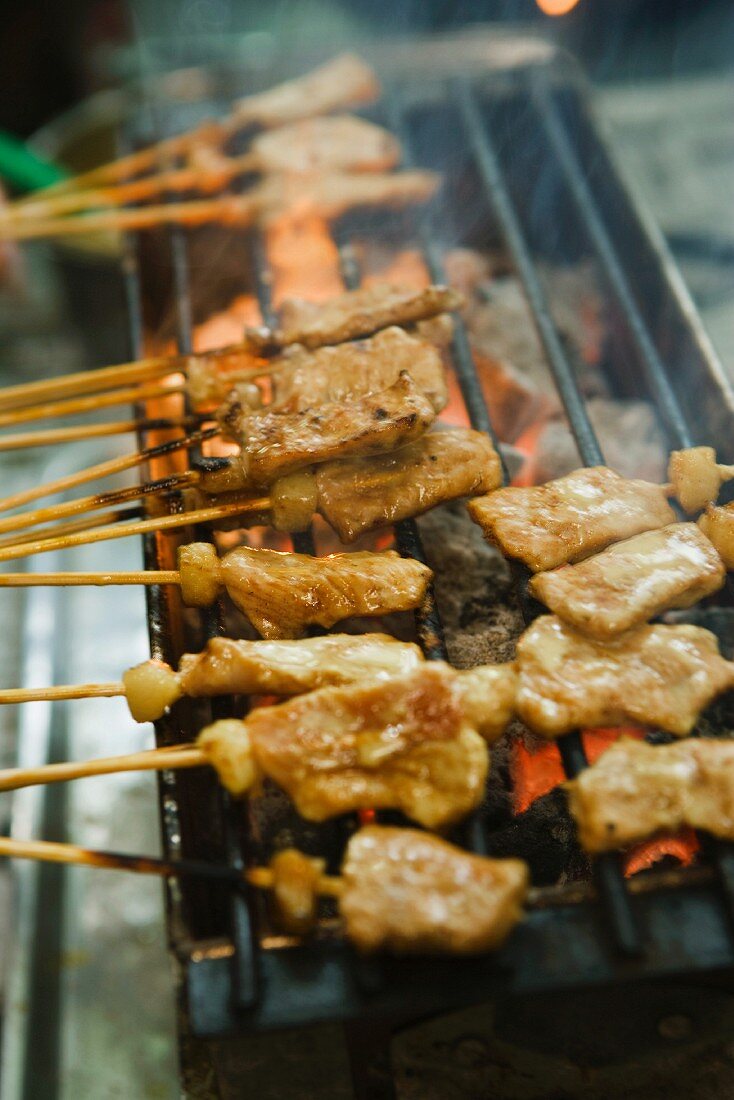 Pork kebabs on a grill