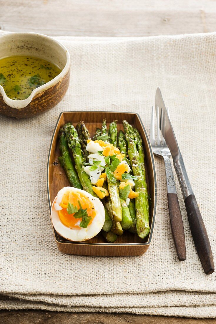 Fried asparagus with a soft-boiled egg