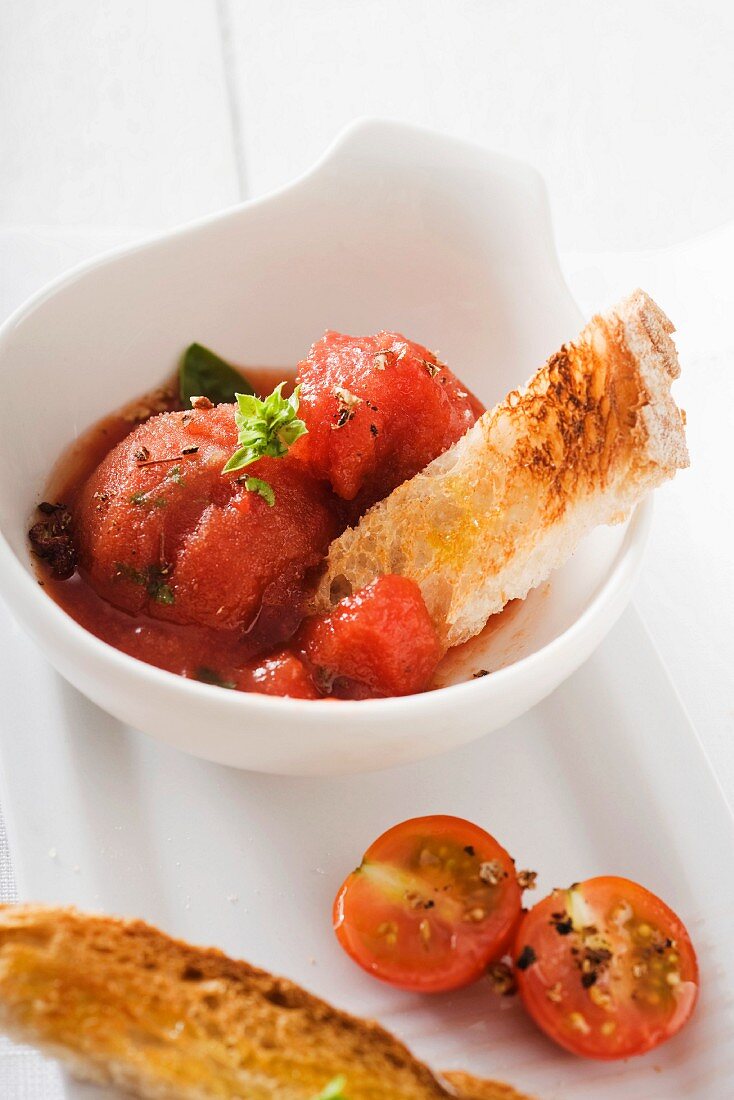 Tomato and basil sorbet with strips of toast